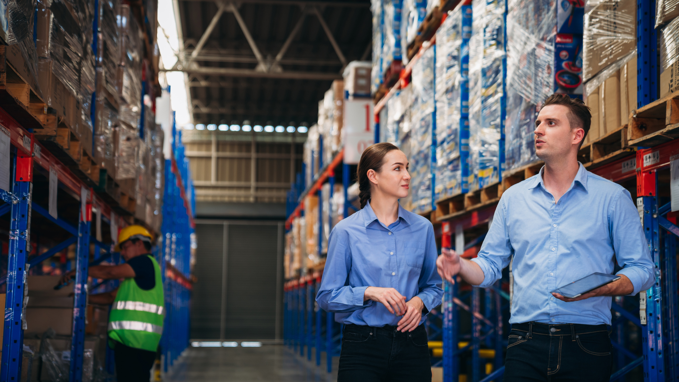 Workers checking stock in a warehouse