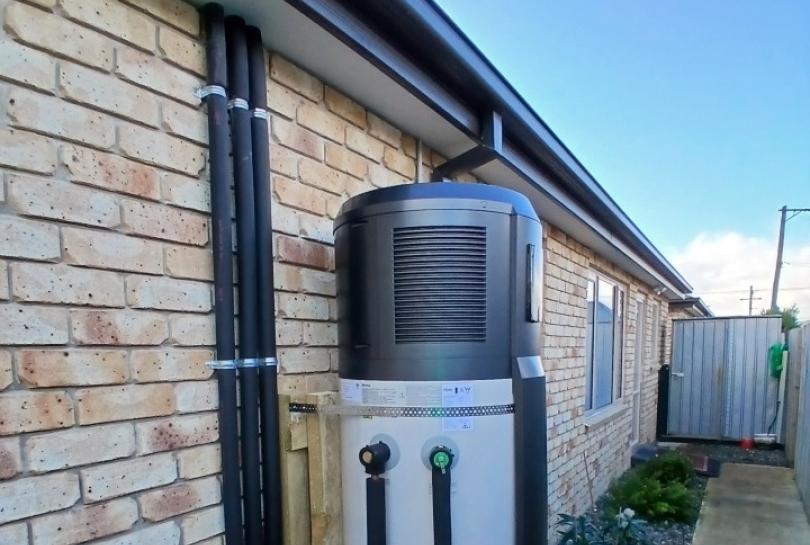 Heat pump water heater installed outside